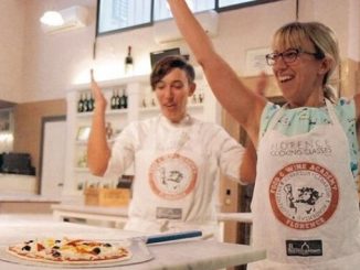 Happy people making pizza