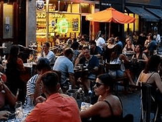 People dining at pavement pizza restaurant