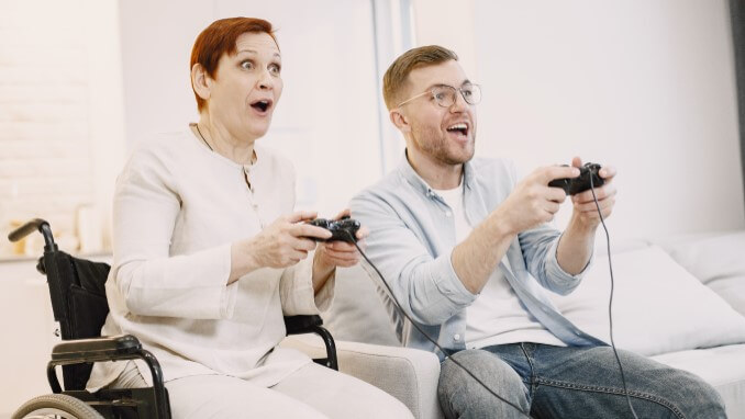 Two adults playing a console game