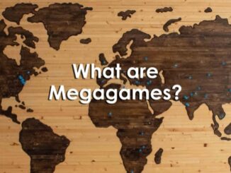 What are Megagames - written on a background of a wooden pyrography world map