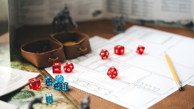 A character sheet with dice and pencil